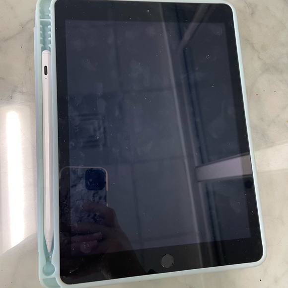iPad 5th generation with teal case and knock-off apple pencil